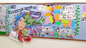 Grade 3 students recreated "Ang Pambihirang Buhok ni Raquel" on their bulletin board using recycled materials for Literacy Month. Photo by Darrel Marco